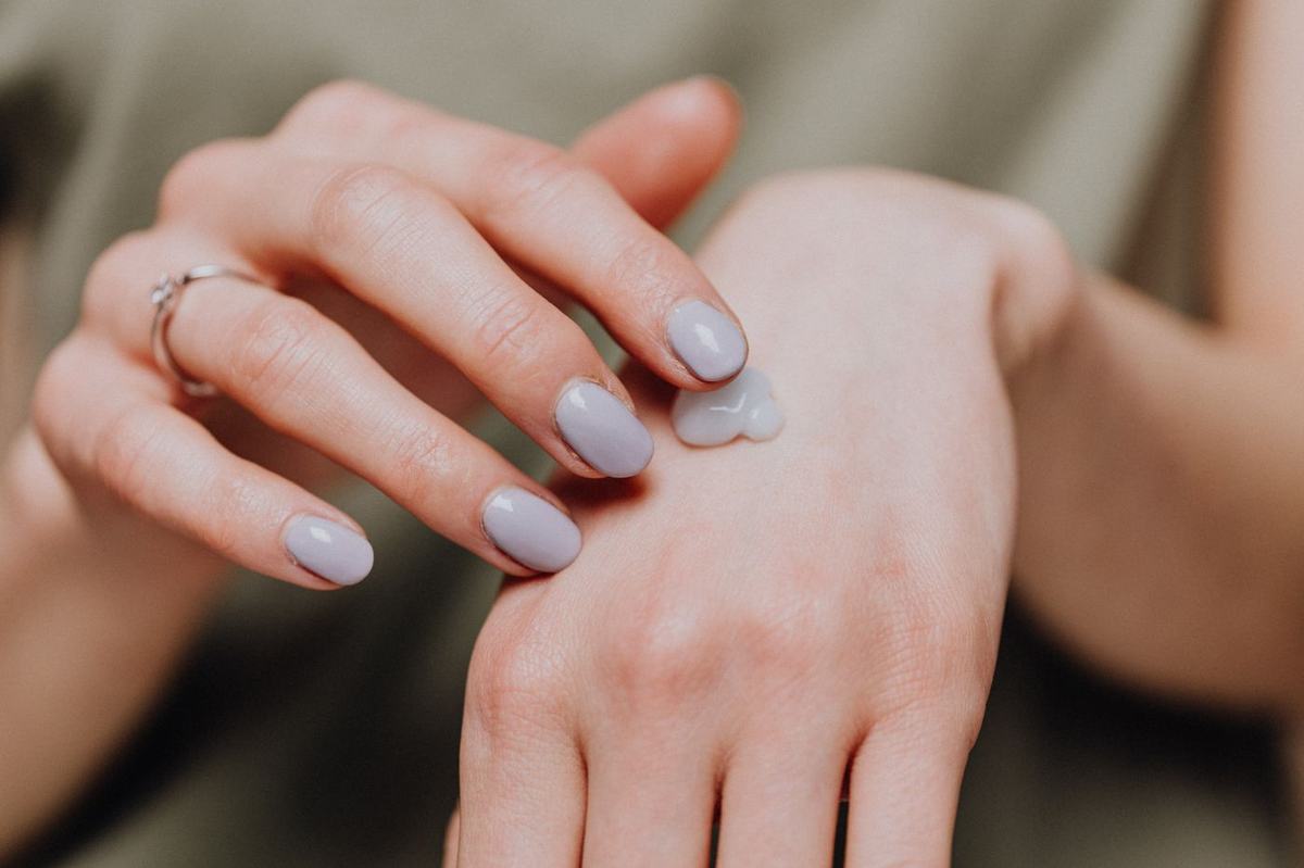 Dermatologist examining a patient's hands