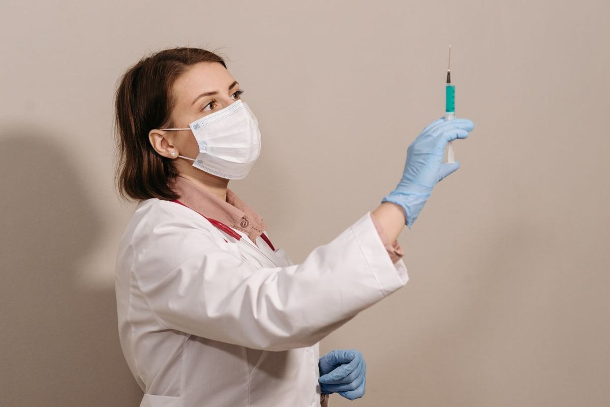 Clinician preparing instruments for a minor skin procedure